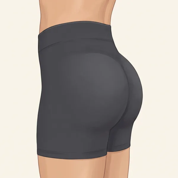 Side view illustration of glutes in charcoal shorts with a glute shelf: the upper glutes are full and project straight back from just below the lower back, making a clear ledge at the top.